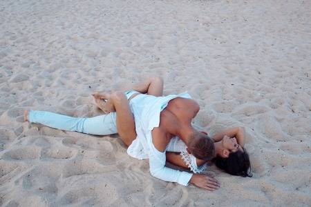 LATO - 101625733-sex-on-beach-concept-couple-full-of-desire-have...ave-sex-on-sand-of-seashore-sensual-lovers-making-love-a.jpg